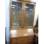 Early XX Century Oak Bureau Bookcase, the top with twin leaded glazed doors, bureau with a fall