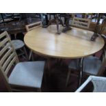 Circular Topped Extending Kitchen Table and Four Ladder Back Chairs. (5)