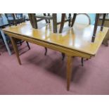 A Scandinavian Teak Draw Leaf Dining Table, with end stretchers to tapering tubular legs, 160cm wide