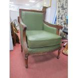 A Walnut Easy Armchair, in the colonial manner with strapwork and acanthus leaf carving, fluted