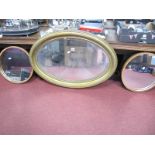 A Pair of Teak Circular Framed Wall Mirrors, 39.5cm diameter, an oval gilt framed wall mirror. (3)