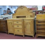 A XIX Century Pine Dresser, the shaped back with applied fruit decoration, C scroll decoration,