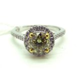 A Modern Fancy Yellow Single Stone Diamond Ring, four claw set to the centre with a brilliant cut