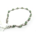 The Genuine Gemstone Company; A Modern 9ct White Gold Stone Set Bracelet, alternately oval claw set,