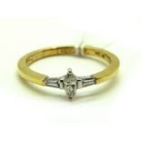 A Modern 9ct Gold Three Stone Diamond Ring, the central marquise cut stone between two tapered