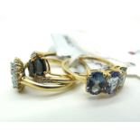 The Genuine Gemstone Company; A Modern 9ct Gold Dress Ring, oval claw set stones, between inset