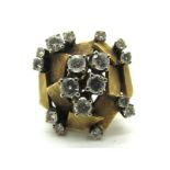 A Vintage Diamond Set Cocktail Dress Ring, of abstract textured design, claw set throughout with