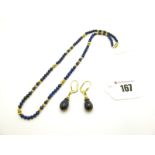 A Single Strand Lapis Lazuli Bead Necklace, of uniform design with reeded bead spacers; together