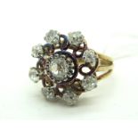 A Victorian Diamond Set Cluster Ring, of openwork design claw set throughout with graduated old