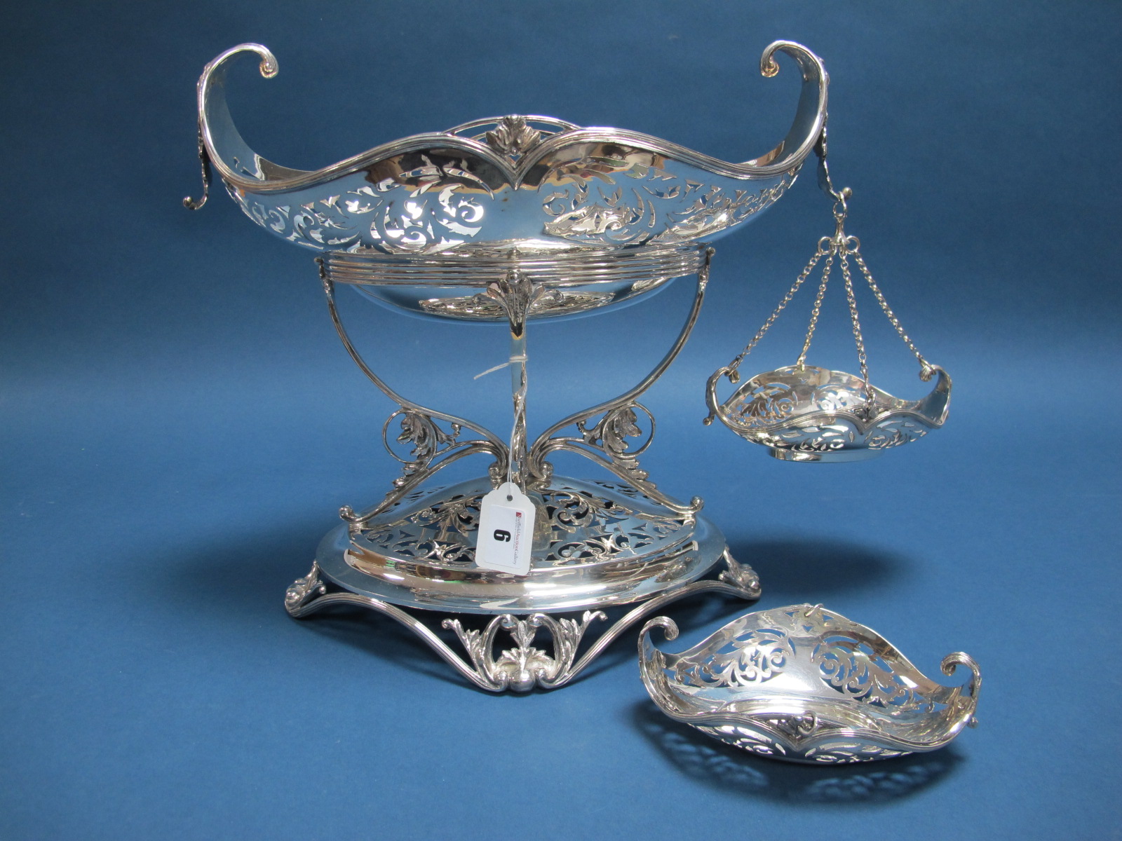 A Highly Decorative Art Nouveau Style Basket Centrepiece, the shaped oval dish leaf scroll