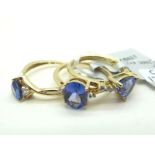 The Genuine Gemstone Company; A Modern 9ct Gold Single Stone Ring, oval claw set centre, between