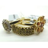 The Genuine Gemstone Company; A Modern 9ct Gold Three Row Dress Ring, claw set throughout, between