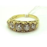 A Victorian Style Five Stone Diamond Ring, the graduated old cut stones within scroll carved setting