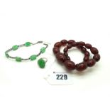 A Carved Jade Set Panel Bracelet, claw set with pierced spacers, to snap clasp; Together with A
