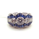 An Art Deco Style Sapphire and Diamond Set Cocktail Ring, graduated circular rubover set to the