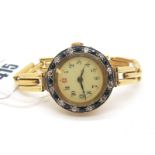An 18ct Gold Cased Sapphire and Diamond Set Ladies Wristwatch, the dial with black and red Arabic