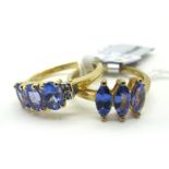 The Genuine Gemstone Company; A Modern 9ct Gold Three Stone Ring, oval claw set, between inset