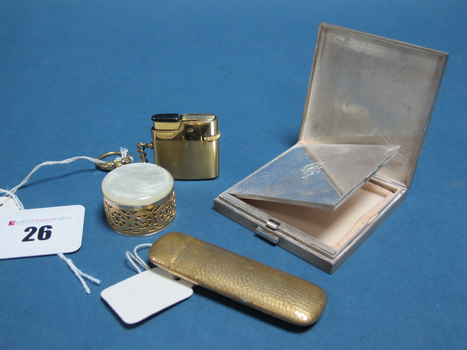 A Hallmarked Silver Powder Compact, allover engine turned; a brass type needle case etc