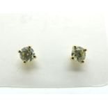 A Pair of Champagne Colour Single Stone Diamond Earstuds, each brilliant cut stone four claw set,