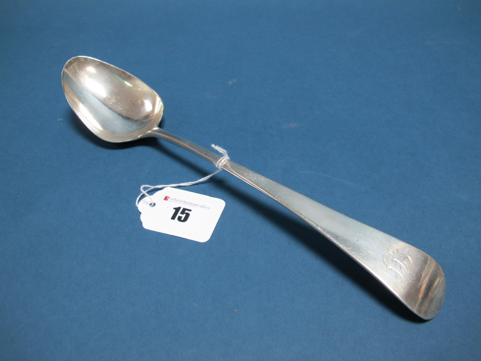 A Hallmarked Silver Old English Pattern Basting Spoon, GW, London 1810, initialled, 29cm long.