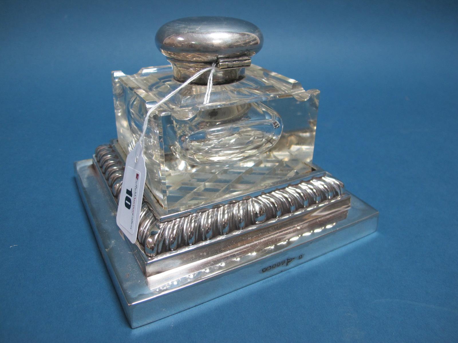 A Large Walker & Hall Plated Mounted Glass Inkwell, the plain square glass bottle with pen rest