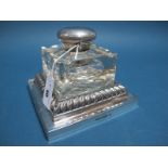 A Large Walker & Hall Plated Mounted Glass Inkwell, the plain square glass bottle with pen rest