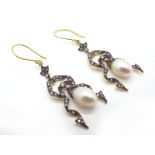 A Pair of Antique Style Pearl and Diamond Set Drop Earrings, of stylised openwork design, on