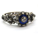 A Victorian Diamond and Enamel Bangle, of openwork design, set throughout with graduated rose cut