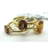 The Genuine Gemstone Company; A Modern 9ct Gold Single Stone Ring, oval four claw set, between plain