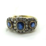 A Sapphire and Diamond Set Triple Cluster Dress Ring, graduated collet rubover set with three