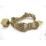 A Wide Fancy Link Bracelet, of tapered design, stamped "9ct", to heart shape padlock clasp,