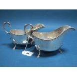 A Pair of Hallmarked Silver Sauce Boats, D&MD, Sheffield 1909, each with gadrooned edge and flying