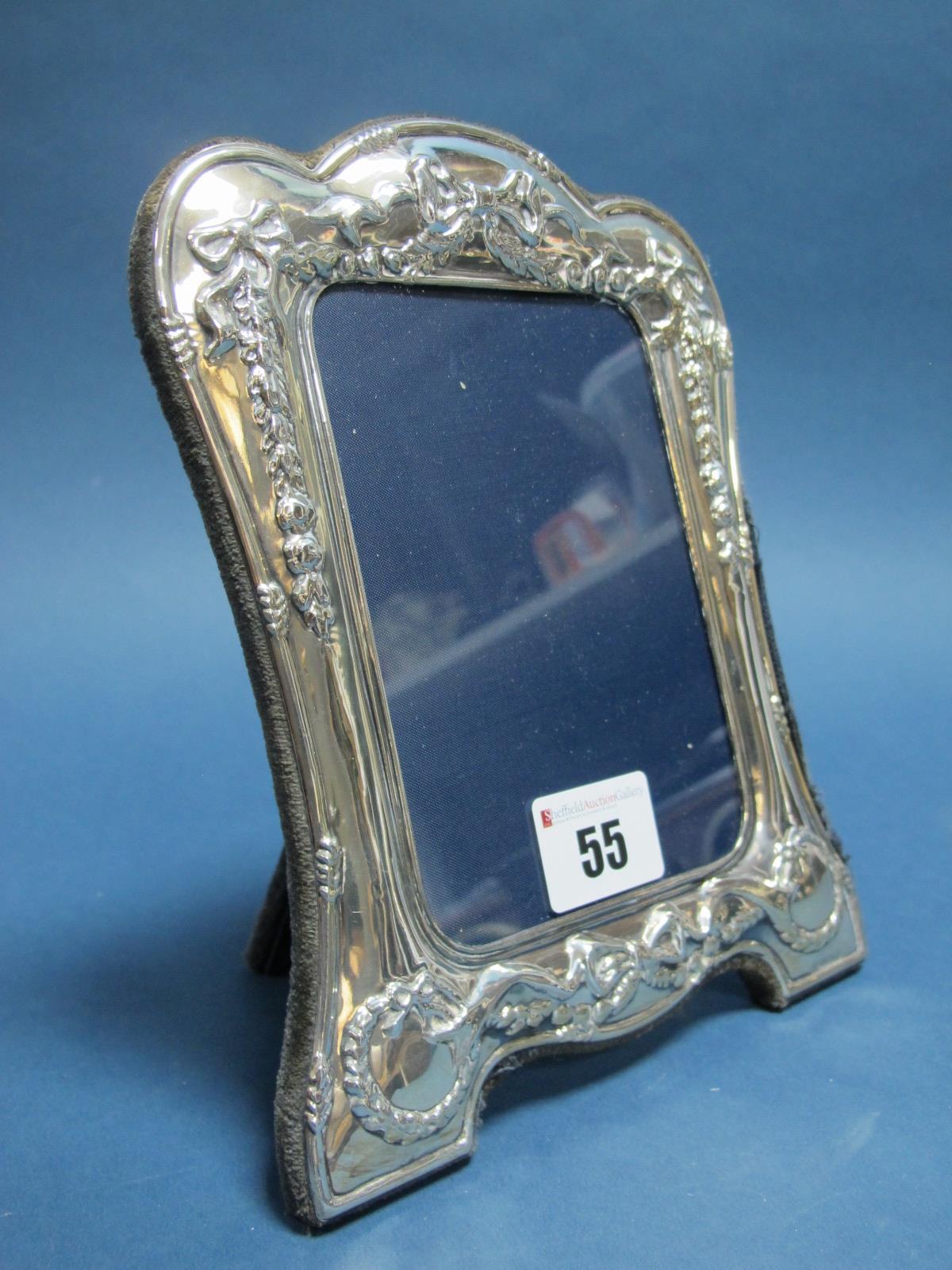 A Decorative Hallmarked Silver Mounted Photograph Frame, R.Carr, Sheffield 1990, of shaped design,