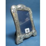 A Decorative Hallmarked Silver Mounted Photograph Frame, R.Carr, Sheffield 1990, of shaped design,