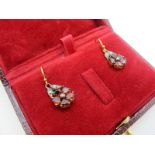A Pair of Antique Style Garnet Set Flowerhead Drop Earrings, each claw set cluster below diamond set