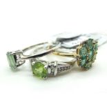 The Genuine Gemstone Company; A Modern 9ct Gold Cluster Dress Ring, oval claw set stones, between