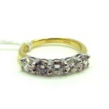 An 18ct Gold Five Stone Diamond Ring, the uniform brilliant cut stones claw set, approximate total