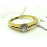 A Modern Single Stone Diamond Ring, the old cut stone inset between claw set bifurcated shoulders,