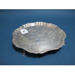 A Hallmarked Silver Salver, JS, Sheffield 1929, of plain shaped design, raised on four hoof feet,