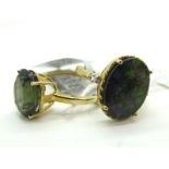 The Genuine Gemstone Company; A Modern 9ct Gold Dress Ring, high oval claw set,between plain