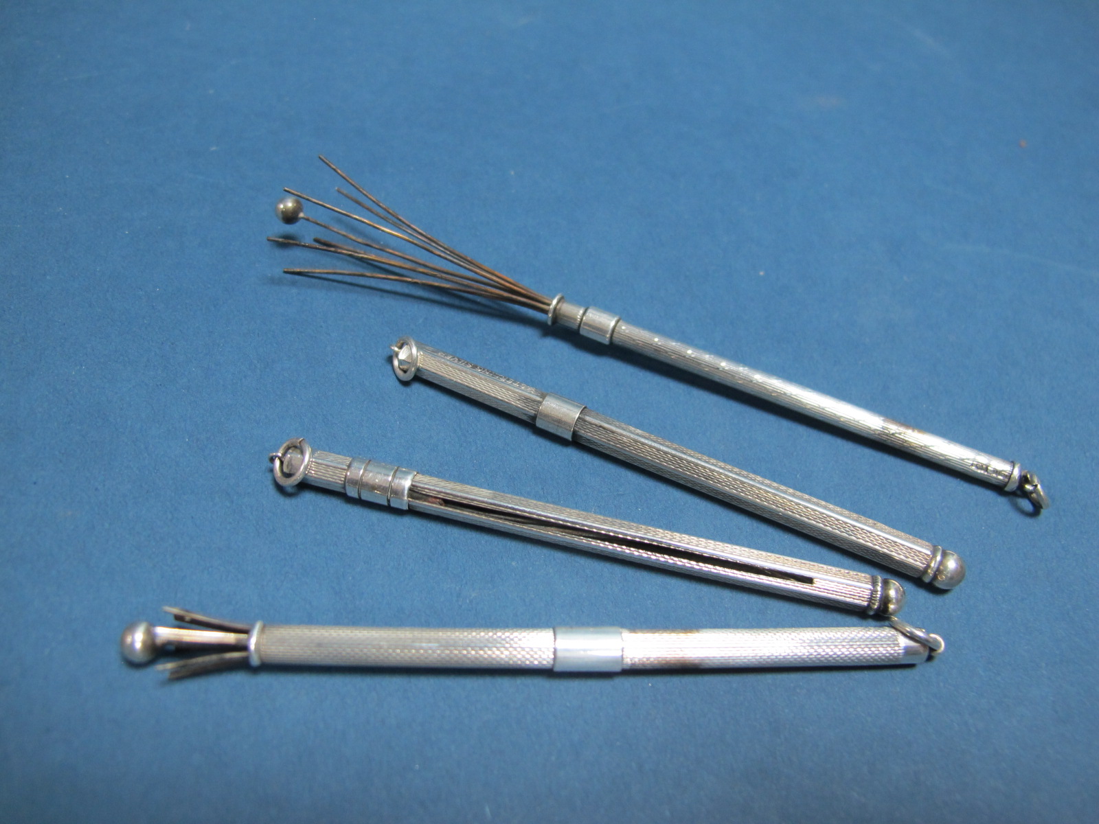 Four Vintage Hallmarked Silver and "Sterling Silver" Sliding Cocktail Stirrers/Swizzle Sticks, all