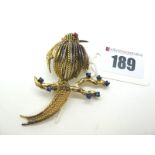 Christian Dior; A Vintage Costume Brooch, as a bird on a branch, of stylised design with claw set