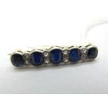 A Sapphire and Diamond Set Bar Brooch, oval collet rubover set with five oval sapphires, rose cut