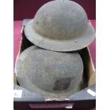 Two WWII British Steel Helmets, both with insignia, liners and chin straps present.