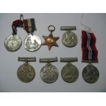 Two WWII Defence Medals, Three WWII War Medals, a WWII Africa Star, and two commemorative