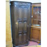 A XX Century Oak Hall Wardrobe, with linen fold panelled door, 178cm high x 80cm wide.