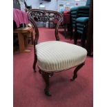 A Mid XIX Century Walnut Nursing Chair, with pierced top rail with 'C' scroll decoration and