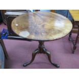 An XVIII Century Mahogany Pedestal Table, with circular top, on turned pedestal and cabriole legs on