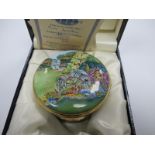 A Moorcroft Circular Enamel Trinket Box, handpainted with 'Eve's Garden', limited edition No. 84/