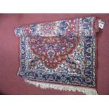Persian Style Wood Rug, with central motif with tassel ends, 145cm x 92cms.